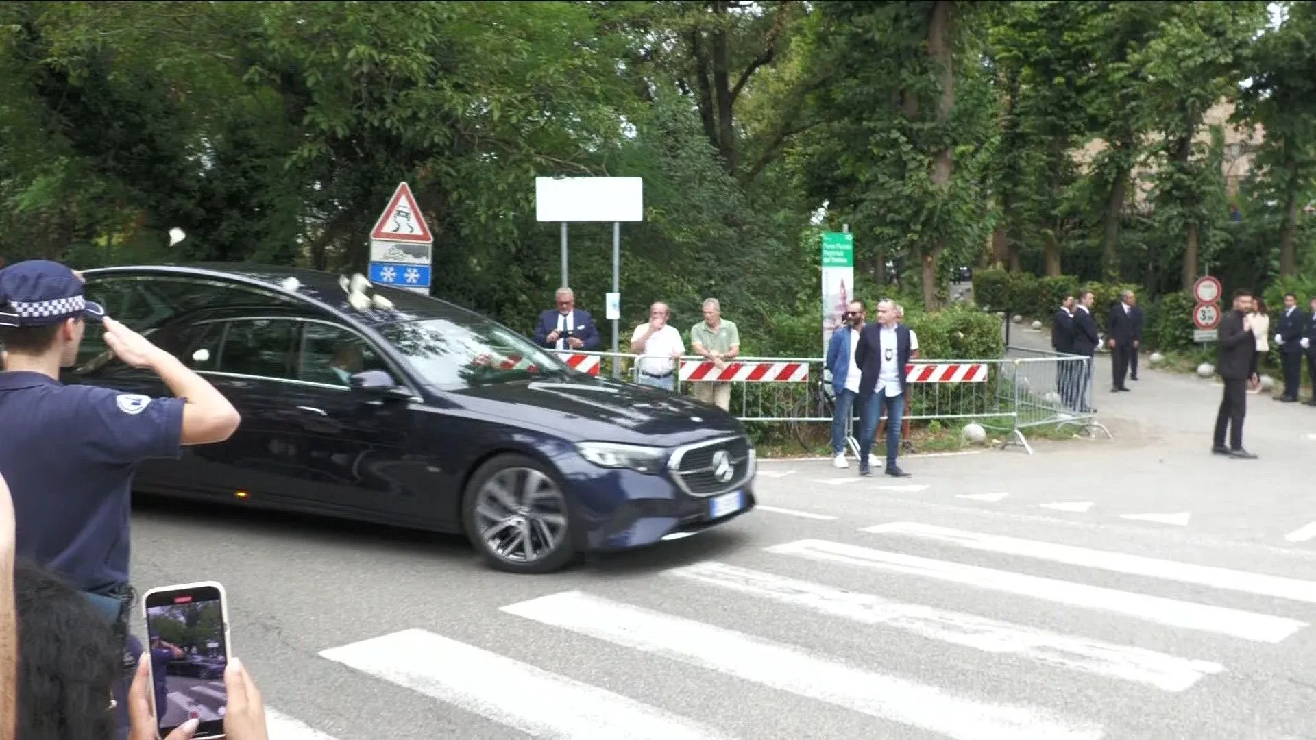Giorgio Armani's hearse arrives at the churhc for a private funeral