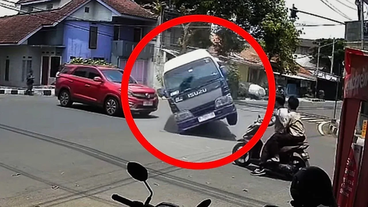 Speeding minivan overturns into shop after near miss