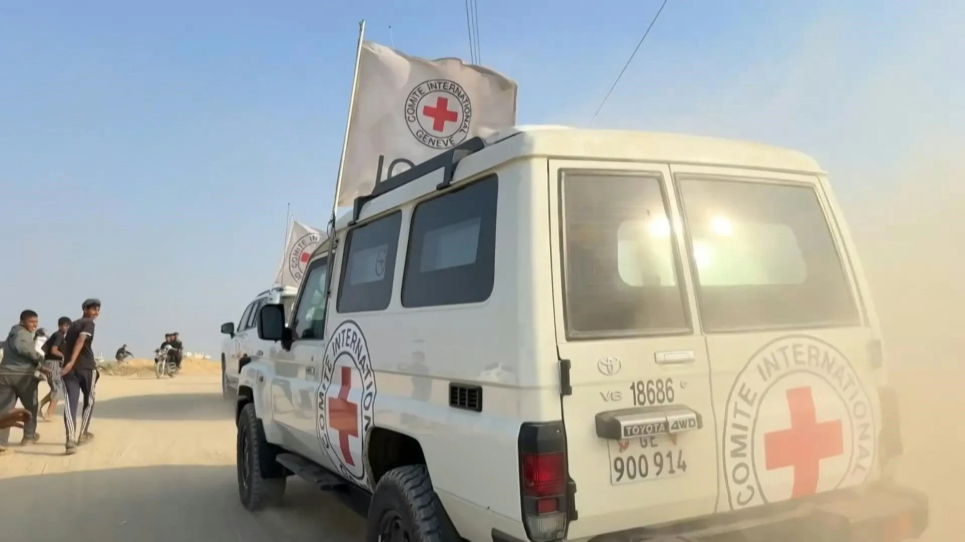 Red Cross vehicles transport remains of officer killed in 2014 Gaza war