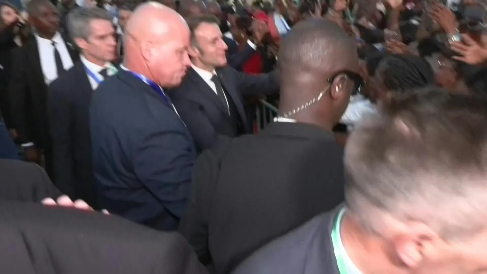 Emmanuel Macron greets crowds upon his arrival in Gabon